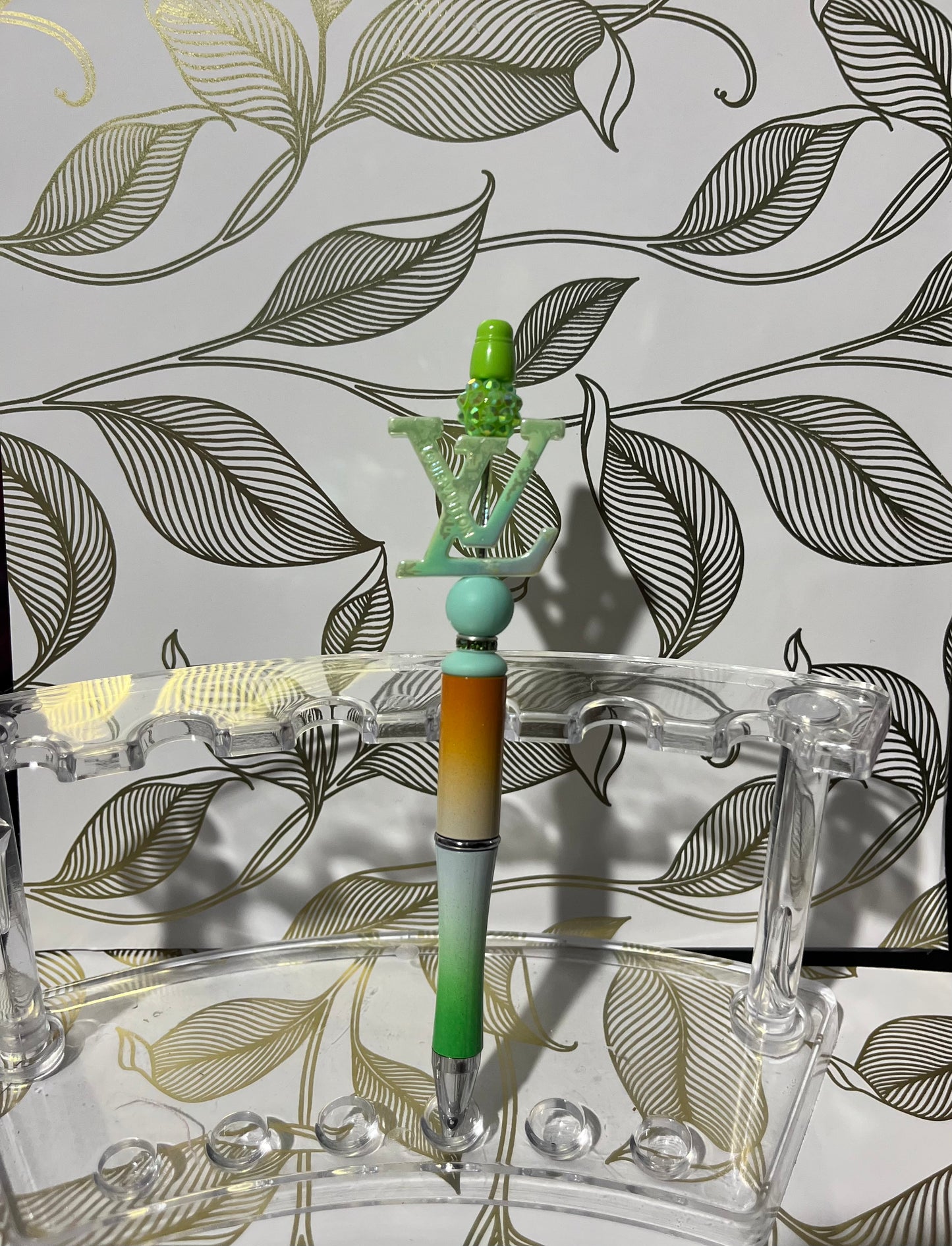 Green LV beaded pen.